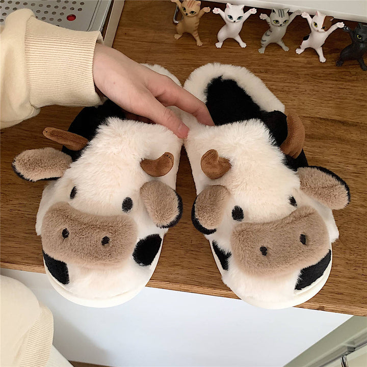 Fluffy tøfler med ku-ansikt